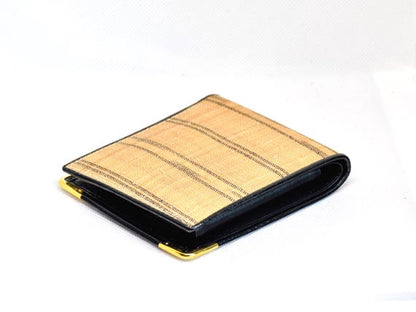 Bashofu banana fiber purse angled view highlighting the gold-toned corners