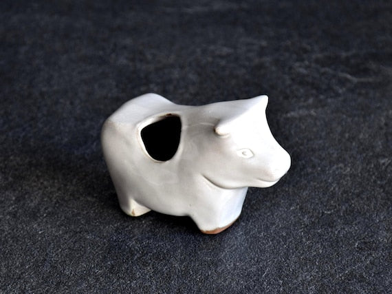 Japanese Ceramic Cow Figurine with smooth white glaze and zodiac ox motif from Japan
