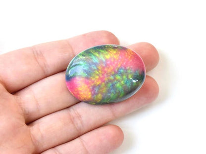 Kutani Pink & Green Ceramic Brooch shown for size held in an open hand