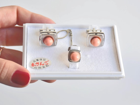 Ezaki Coral Cufflinks & Tie Pin Set in original box held in hand showing the front view