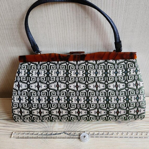 Kotan-Ori Kimono Bag front view displaying the geometric textile pattern and black leather handle