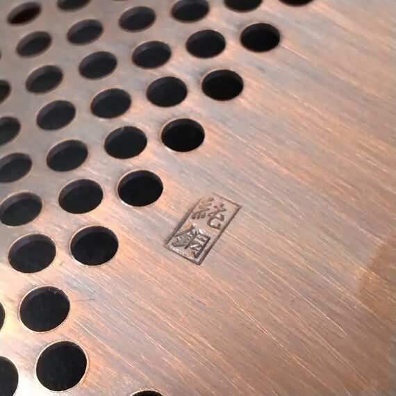 Copper Openwork Floral Saucers base detail showing maker stamp in Japanese characters