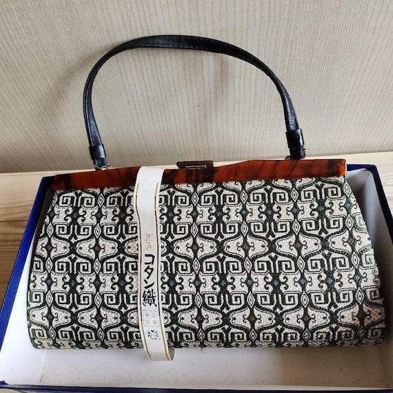 Kotan-Ori Kimono Bag resting inside its traditional patterned storage box with paper band attached