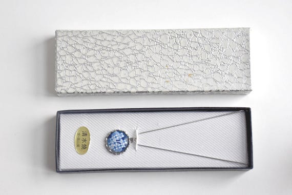 Kiyomizu-yaki Blue Floral Pendant Necklace displayed inside its original patterned gift box