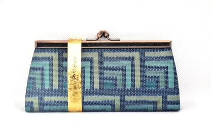 Oshima Tsumugi silk coin purse back view highlighting the continuous geometric silk pattern