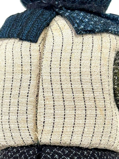 Omeshi Ningyō Doll traditional Japanese kokeshi doll close-up of striped Omeshi silk textile pattern