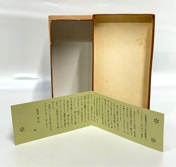 Omeshi Ningyō Doll kokeshi from Shiozawa Niigata showing information leaflet