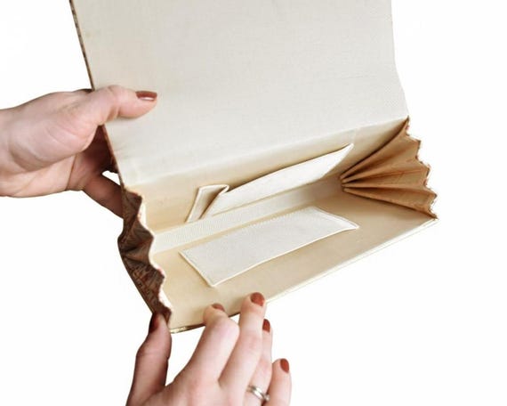 Hexagonal Floral Kimono Clutch open interior being held by two hands