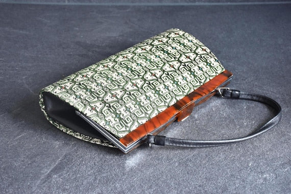 Kotan-Ori Kimono Bag angled view showing the black side gusset and tortoiseshell frame