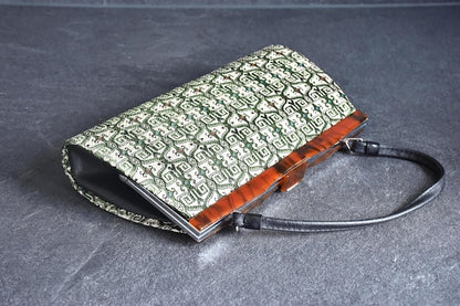 Kotan-Ori Kimono Bag angled view showing the black side gusset and tortoiseshell frame