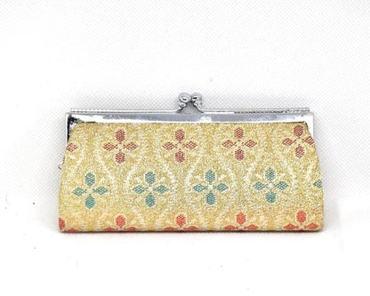 Saga Nishiki coin purse back view in orange with a detailed traditional woven brocade pattern