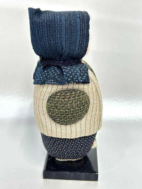 Omeshi Ningyō Doll traditional Japanese kokeshi doll side view showing detailed textile texture and wooden base