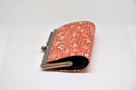 Kaga Yuzen Silk Coin Purse side profile view highlighting the slim shape and metal clasp frame opening