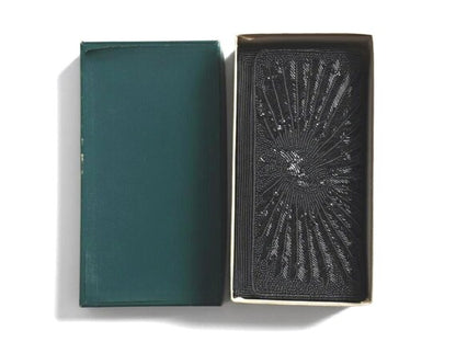Japanese Beaded Peacock Clutch shown alongside its matching dark green storage box