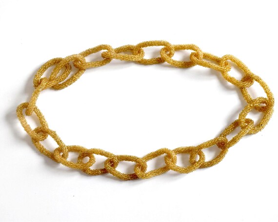 Japanese Golden Loop Beaded Necklace vintage handmade design shown arranged on a white surface