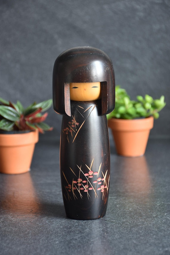 Usaburo Creative Kokeshi Doll frontal view showing the light natural wood face and dark body