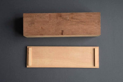 Japanese Kiribako Calligraphy Box showing the underside of the wooden storage box and the back of the sliding lid