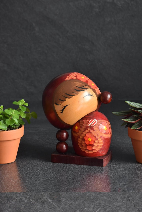 Chie Tamura Pigtail Kokeshi Doll front view showcasing the serene face expression