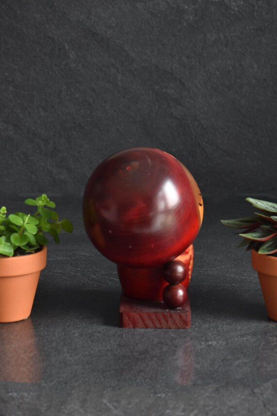 Chie Tamura Pigtail Kokeshi Doll rear angle highlighting the stacked wooden spheres supporting the head
