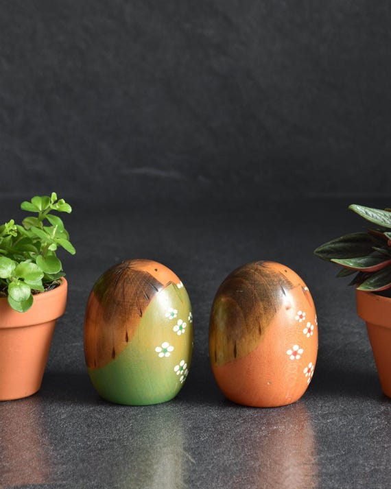 Usaburo Creative Kokeshi Pair angled view showcasing the painted floral details