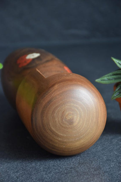 Usaburo Kokeshi Doll Ume No Hana top view of the smooth wooden head and grain pattern
