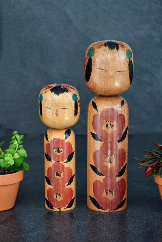Takahashi Hashime Camellia Kokeshi Pair handmade Japanese wooden dolls with painted floral patterns