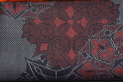 Oshima Tsumugi Kimono Bag pattern detail showing fine woven red and black geometric silk textile