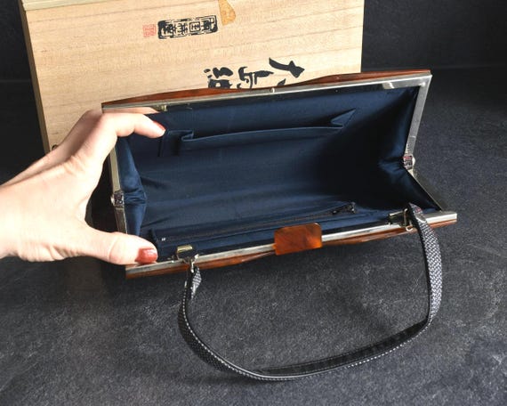 Oshima Tsumugi Kimono Bag inside view with deep navy fabric lining and zippered pocket