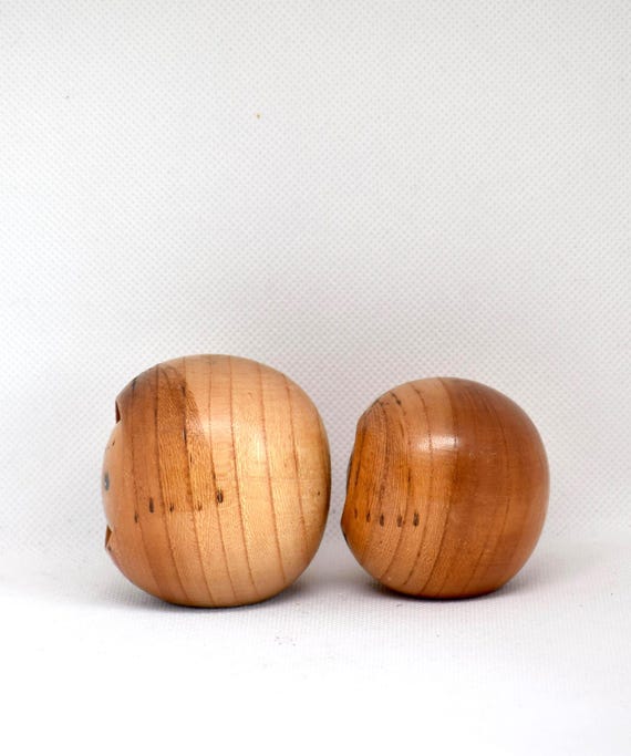 Creative Kokeshi Pair vintage wooden Japanese dolls showing the natural wood grain on the back