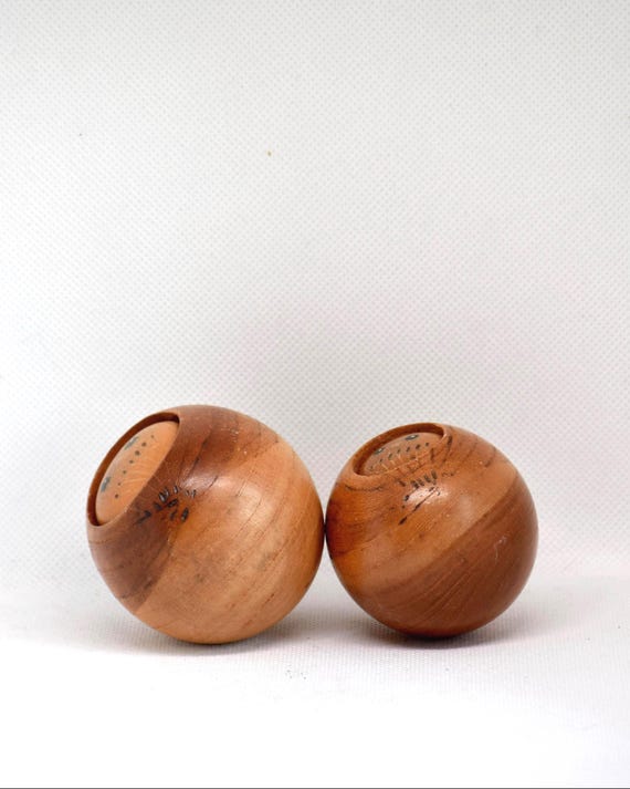 Creative Kokeshi Pair vintage wooden Japanese dolls viewed from a top angle showing painted details