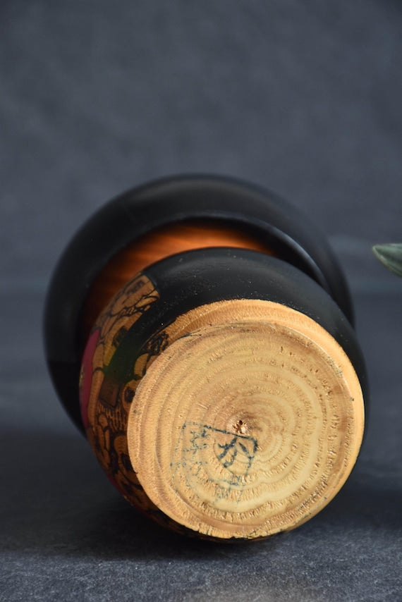 Kazuo Takamizawa creative kokeshi wooden doll base showing the maker signature stamp
