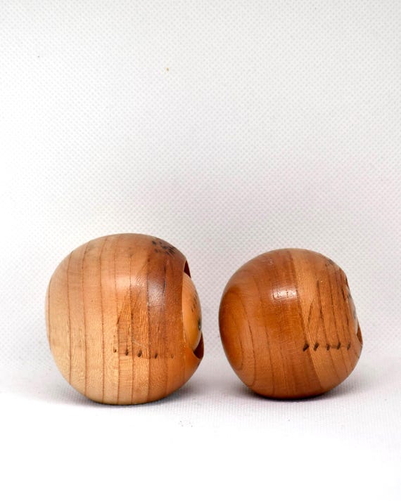 Creative Kokeshi Pair vintage wooden Japanese dolls angled to show the rounded side profile