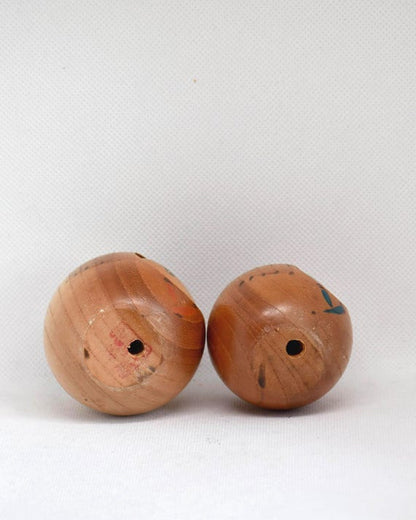 Creative Kokeshi Pair vintage wooden Japanese dolls showing the base with artist stamp