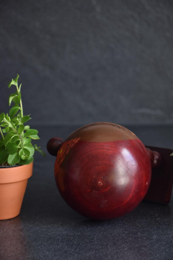 Chie Tamura Pigtail Kokeshi top view of head with visible wood grain and finish