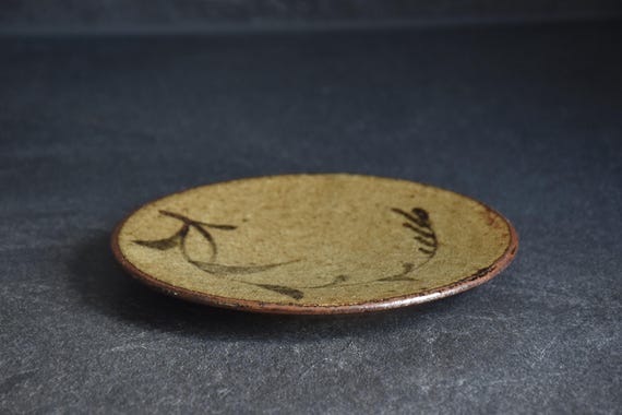 Karatsu-Yaki Botanical Plate low angle view highlighting the organic texture and flat surface