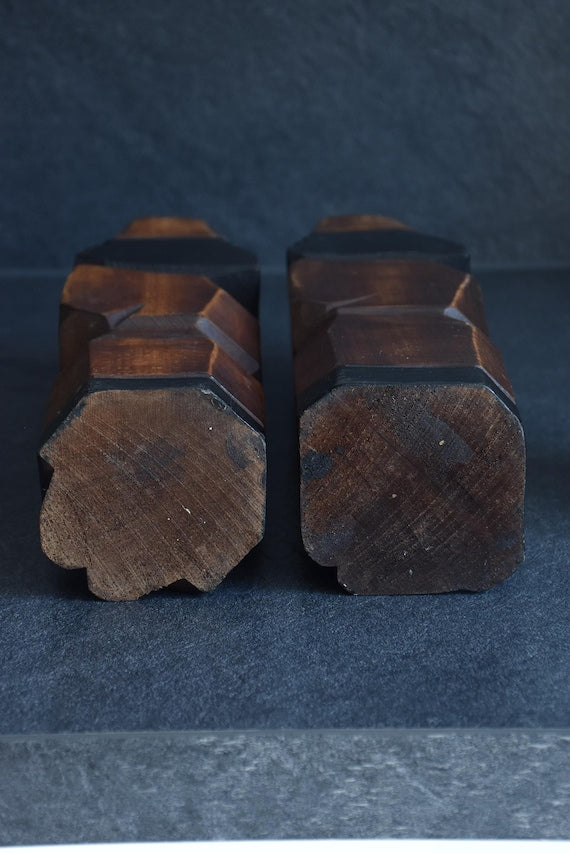 Ainu carved wood figures folk art bases angled view