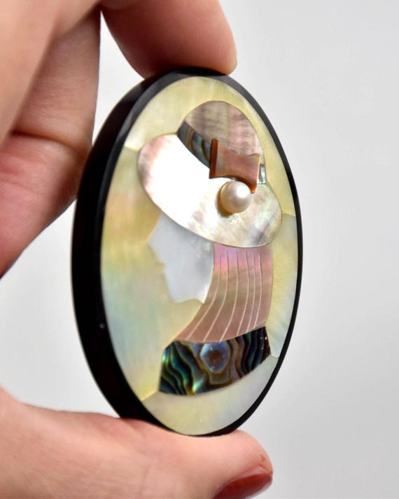 Raden Shell Inlay Portrait Brooch vintage Japanese mother-of-pearl angled view