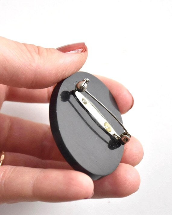 Raden shell inlay brooch back with clasp held in hand