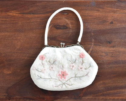 Japanese Floral Beaded Clutch Bag with white and light rosa glass beads, metal frame, and kiss-lock clasp