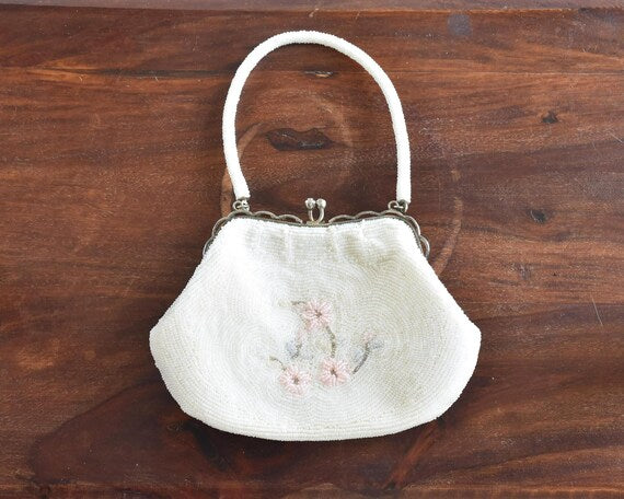 Japanese Floral Beaded Clutch Bag showing the back side with a simple floral beadwork arrangement