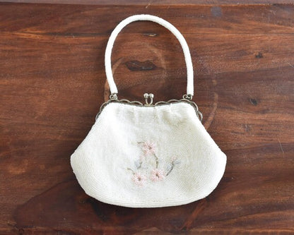 Japanese Floral Beaded Clutch Bag showing the back side with a simple floral beadwork arrangement