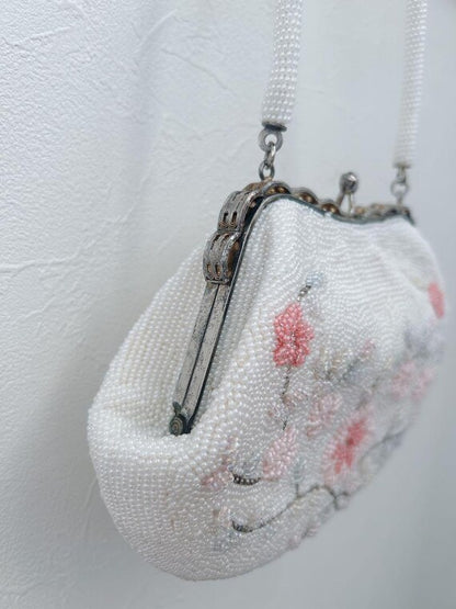 Japanese Floral Beaded Clutch Bag alternative angled side view showing the frame and handle attachment