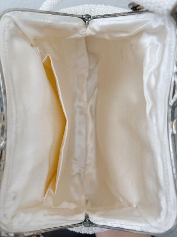 Japanese Floral Beaded Clutch Bag open interior view showing the cream-white lining and two slip pockets