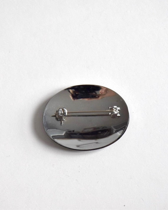Zogan Plum Blossom Brooch viewed from the back showing the secure metal pin and hinge closure