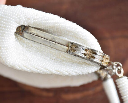 Japanese Floral Beaded Clutch Bag showing side view of the metal frame and hardware details