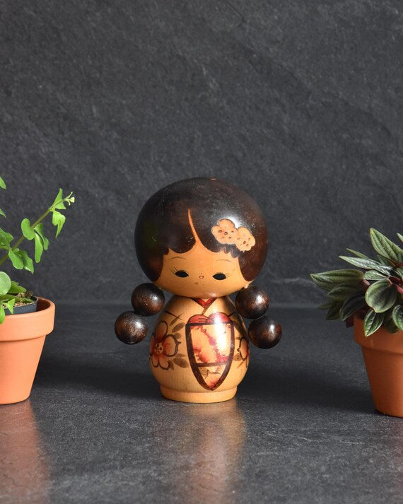 Jiro Tsuda Creative Kokeshi Doll from Miyagi Prefecture featuring round wooden pigtails and painted kimono