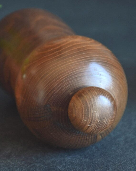 Kazuo Takamizawa kokeshi doll top view of the separate topknot mage and rounded head