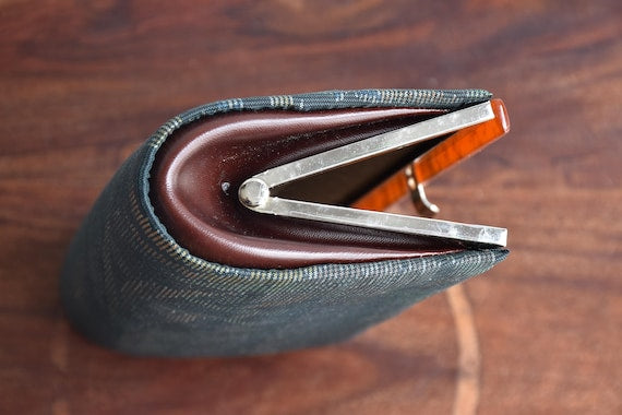 Amami Oshima Tsumugi kimono bag showing the metal frame and clasp detail