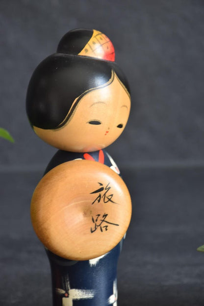 Miyashita Hajime kokeshi doll close-up on the face expression and the round wooden travel hat