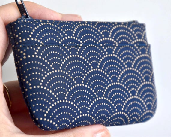 Japanese Deerskin Urushi Pouch coin purse held in hand displaying scale and stenciled lacquer pattern